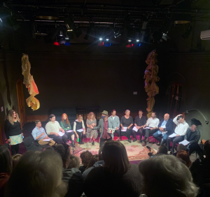 The opening reading at La Mama Courthouse